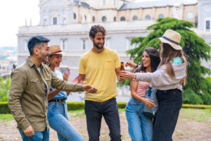 friends partying in a city park with drinks