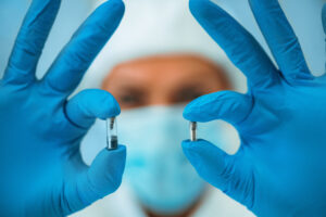 Researcher Comparing Two nano Implant Chips in Laboratory