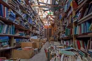 An old abandoned library. Book background. Books on the bookshelf.